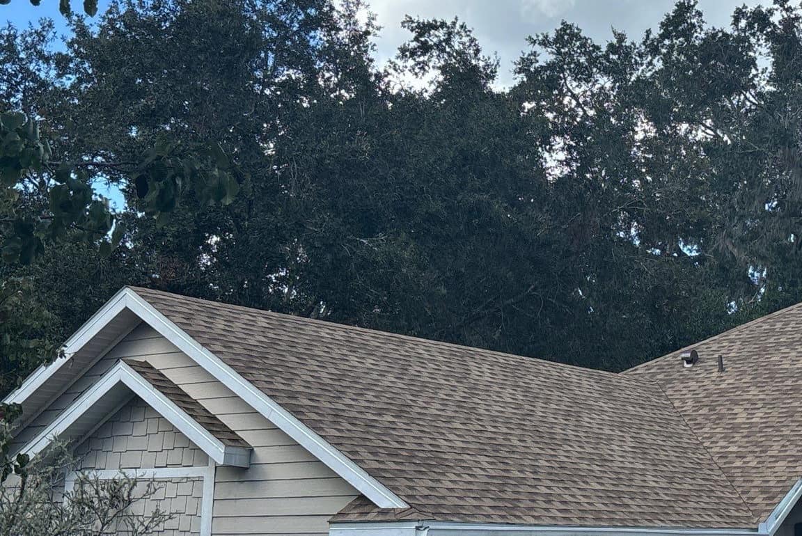Tan shingles on the garage wing in Gainesville, with a small gable stepped out in front