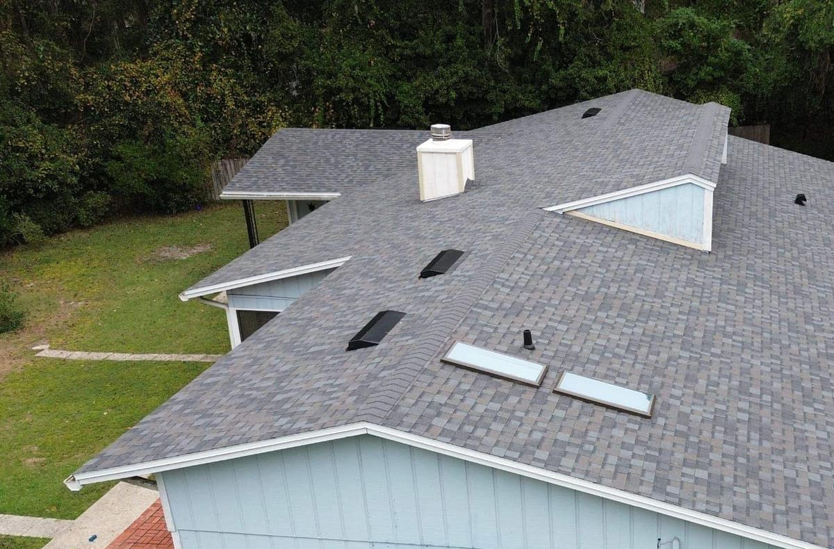 Drone view of the new gray blend shingle roof with two skylights on a Gainesville ranch