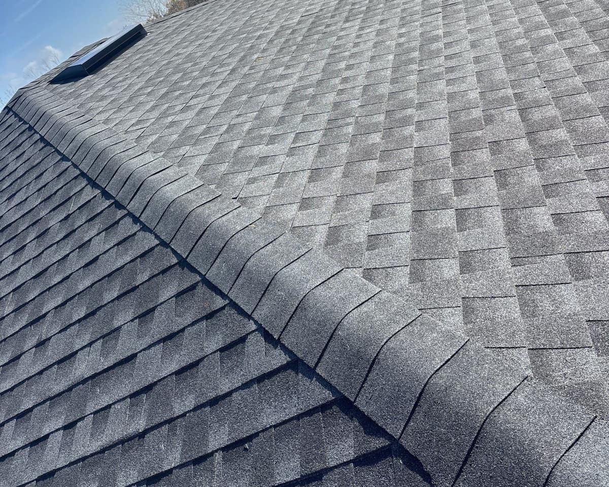 Close view of cap shingles folded over a hip on the Live Oak roof