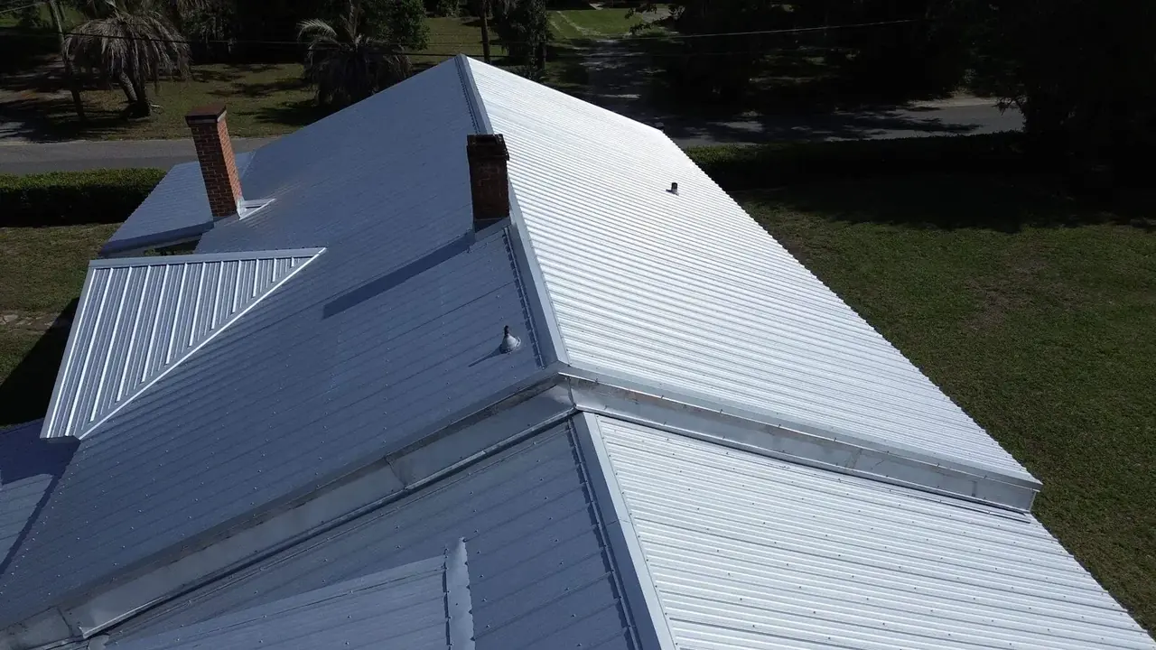 Silver metal roof, aerial view with chimneys in Alachua, Florida