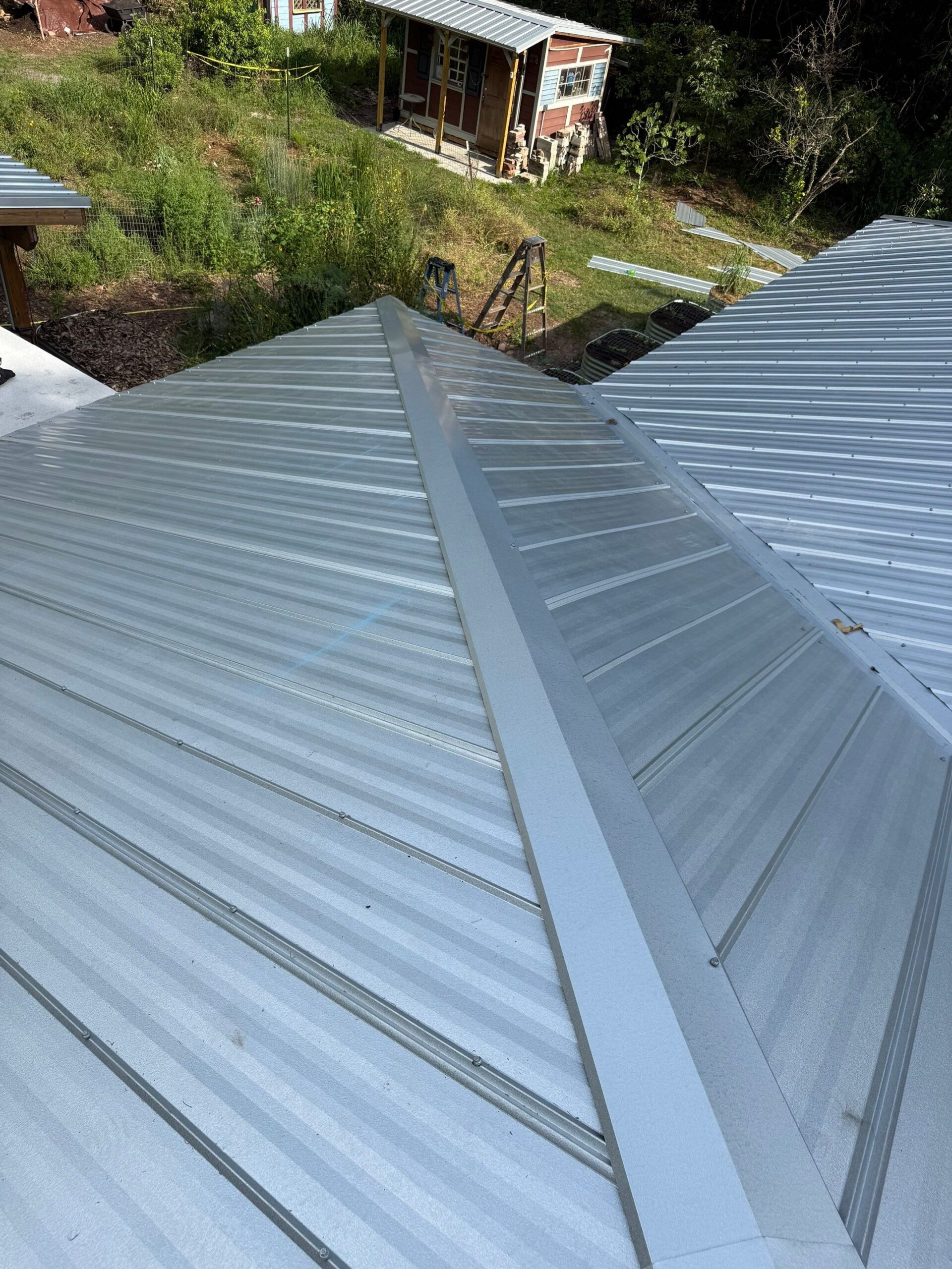 Mill finish Tri County Metals 26g Galvalume 5V roof in Micanopy, FL