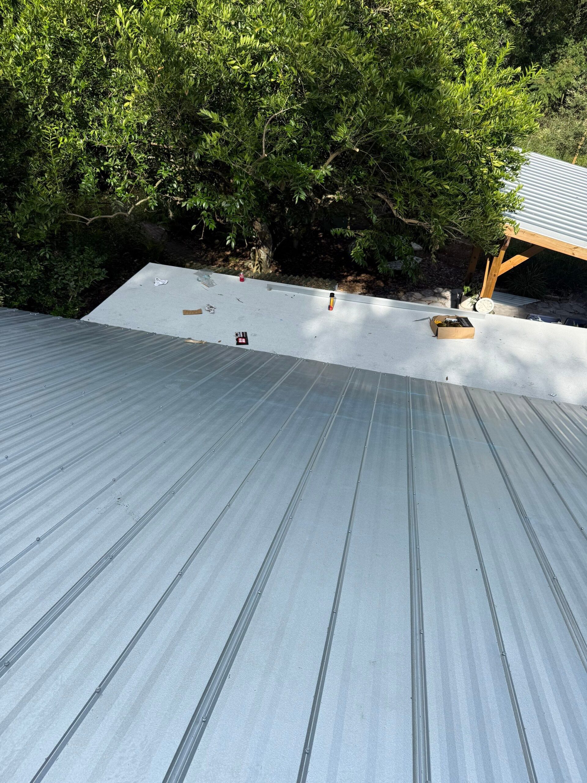 Mill finish 5V metal panels and matching drip edge on a Micanopy reroof