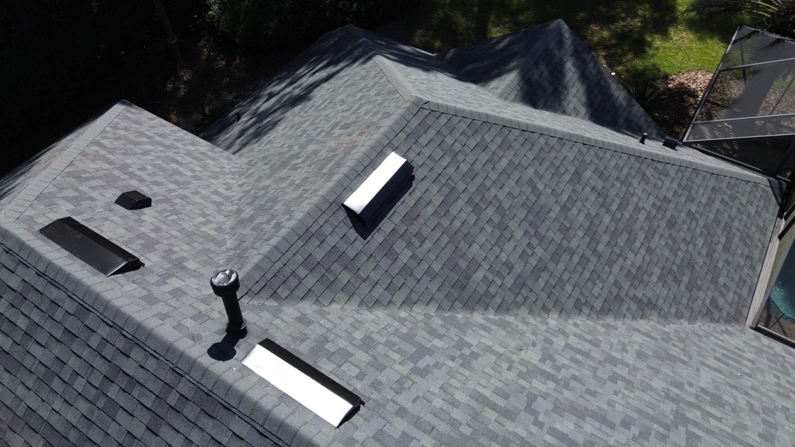 Finished Estate Gray Owens Corning Duration roof with black accessories in Gainesville, FL
