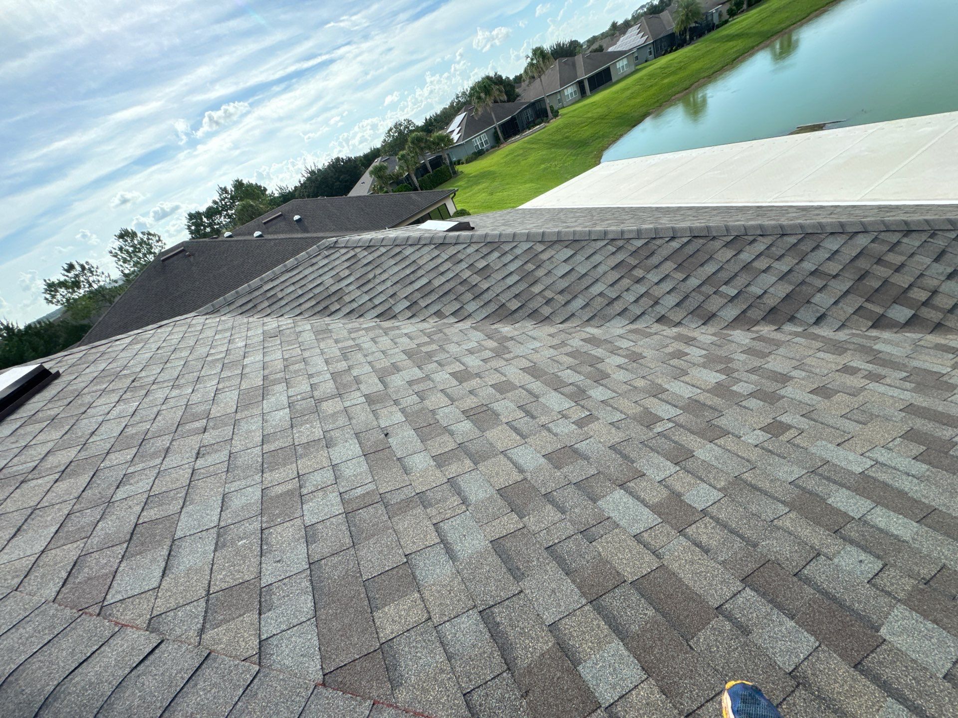 Finished Driftwood shingle roof with brown accessories in Ocala, FL