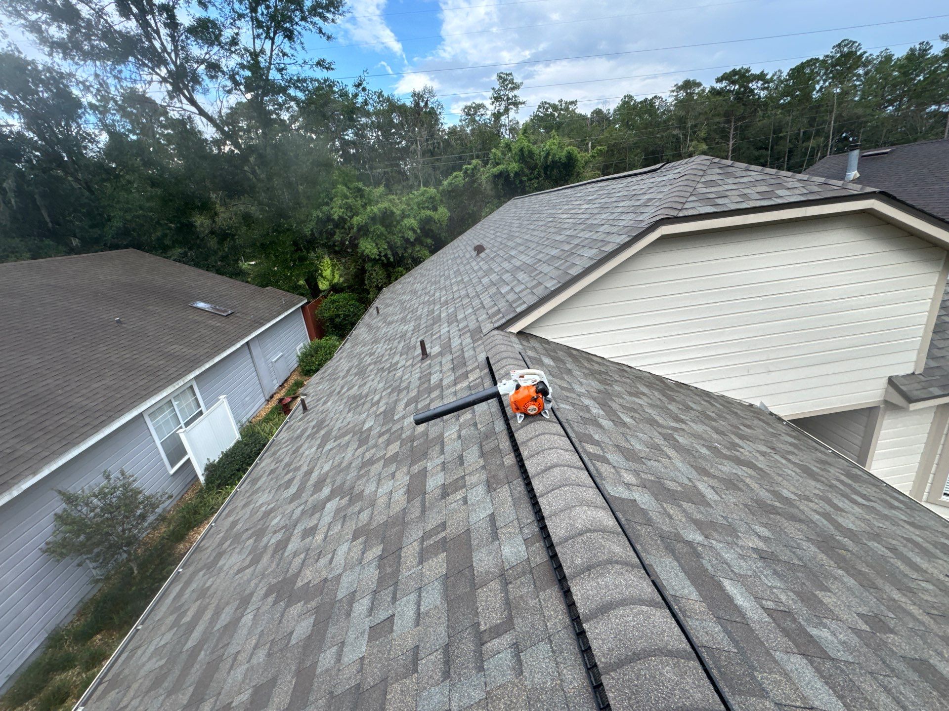 Newberry Duration Driftwood finished roof with brown drip edge