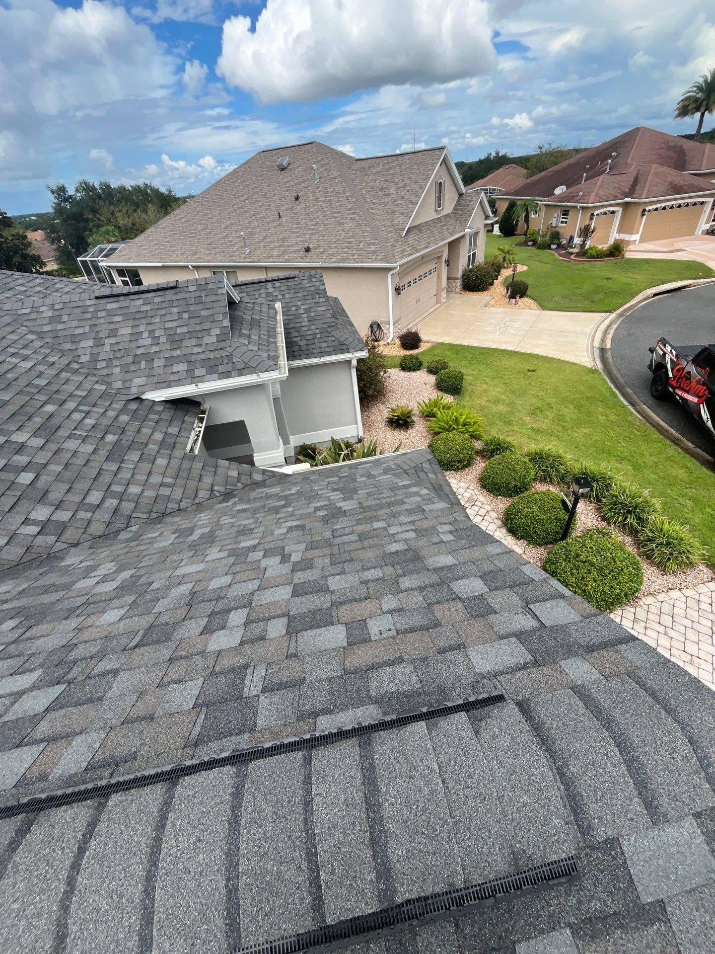 Brehm Roofing truck at finished Moncks Corner Villages reroof