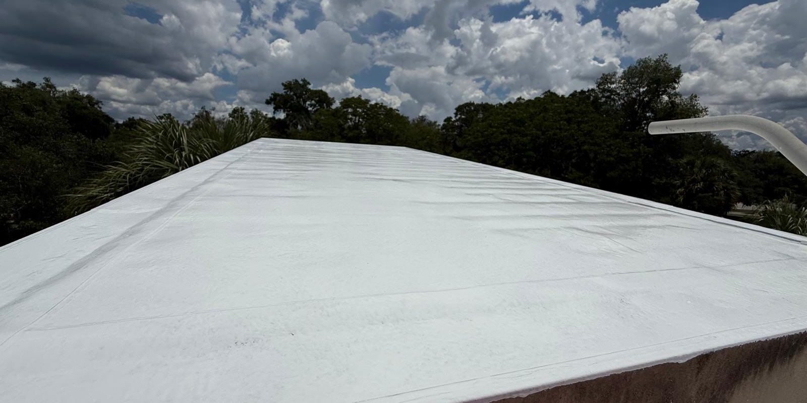 Roofing team working on commercial building